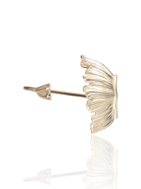 Studio shot of Peplos Aura Cuff Bracelet on white reflective surface