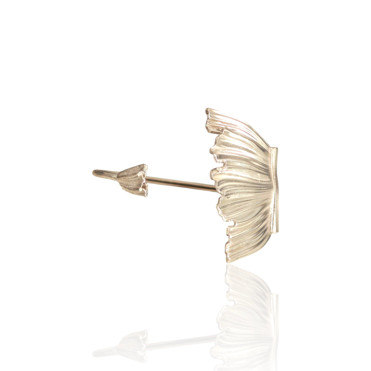 Studio shot of Peplos Aura Cuff Bracelet on white reflective surface