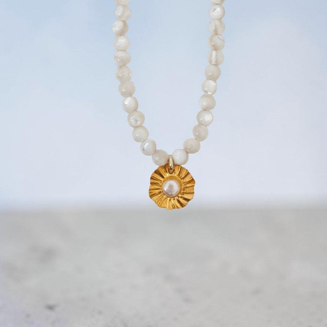 Handmade sun charm necklace with pearl and seashell beads