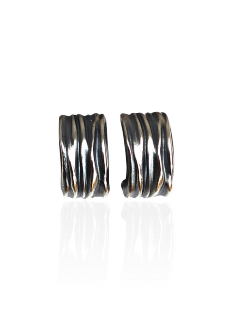 Pair of silver hoop earrings on a white background