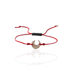 Moon Whisper silver crescent moon bracelet with red adjustable cord and sculptural textured surface.