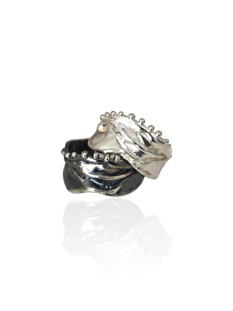 Athenais Hemline Rings in polished silver and oxidized silver, showing contrasting finishes and beaded edges