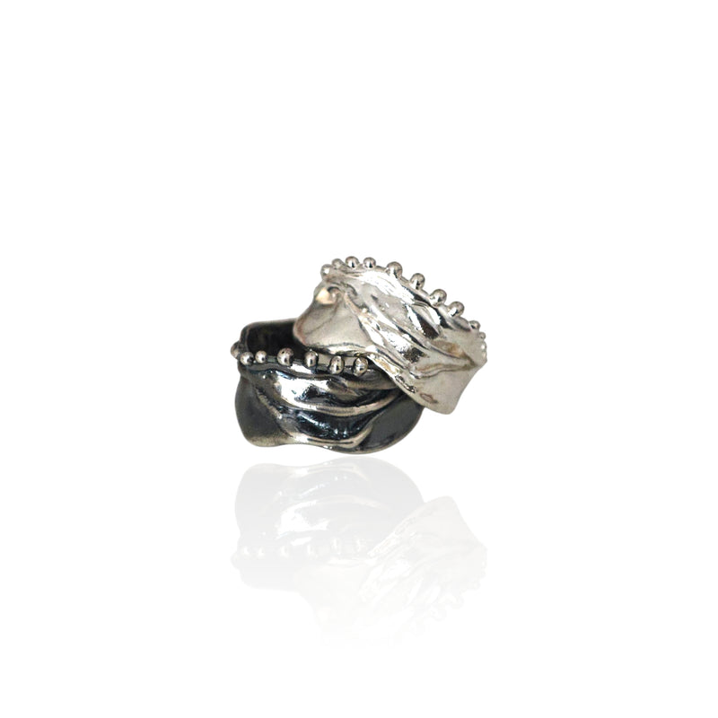 Athenais Hemline Rings in polished silver and oxidized silver, showing contrasting finishes and beaded edges