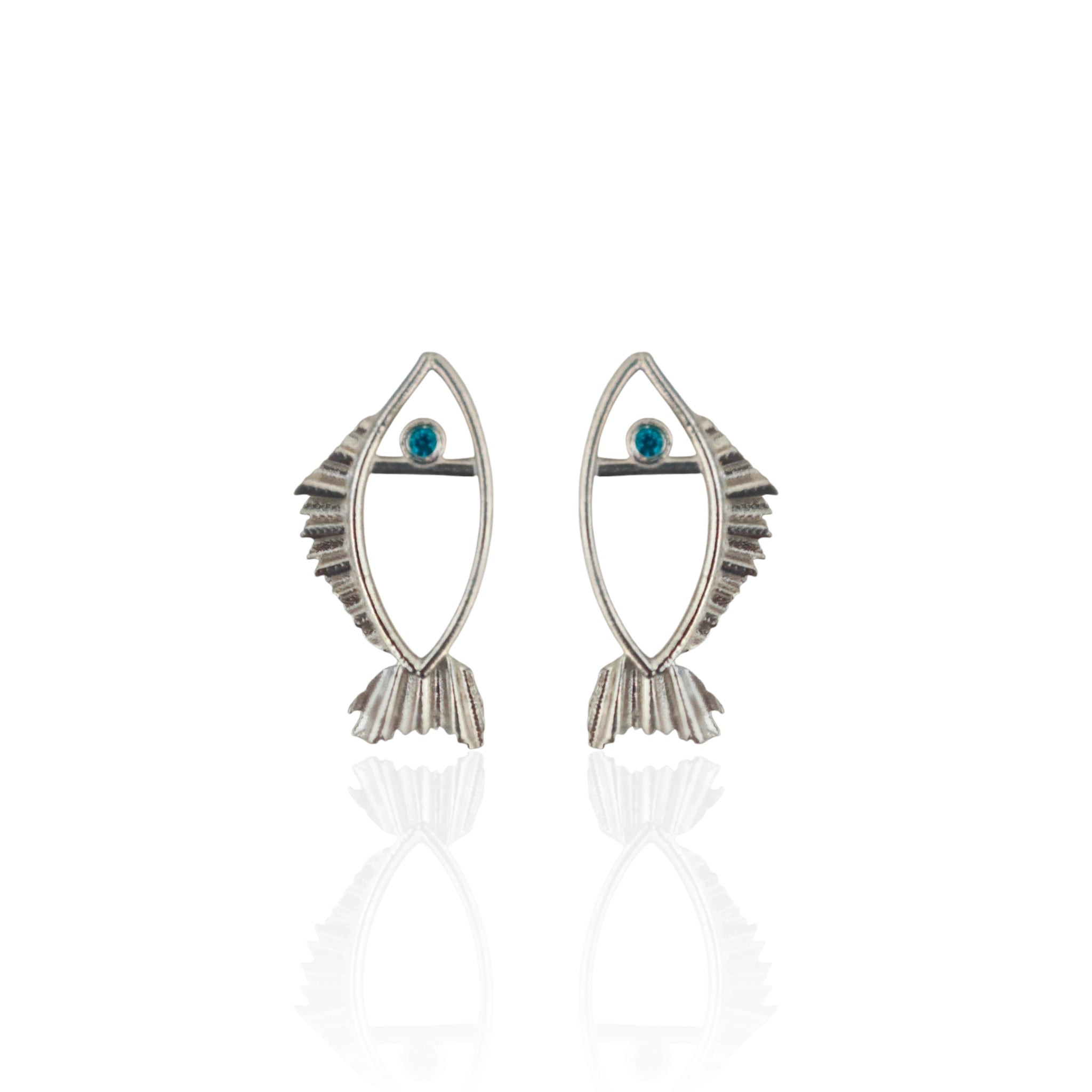 Pair of silver fish-shaped earrings with blue gemstones on a white background