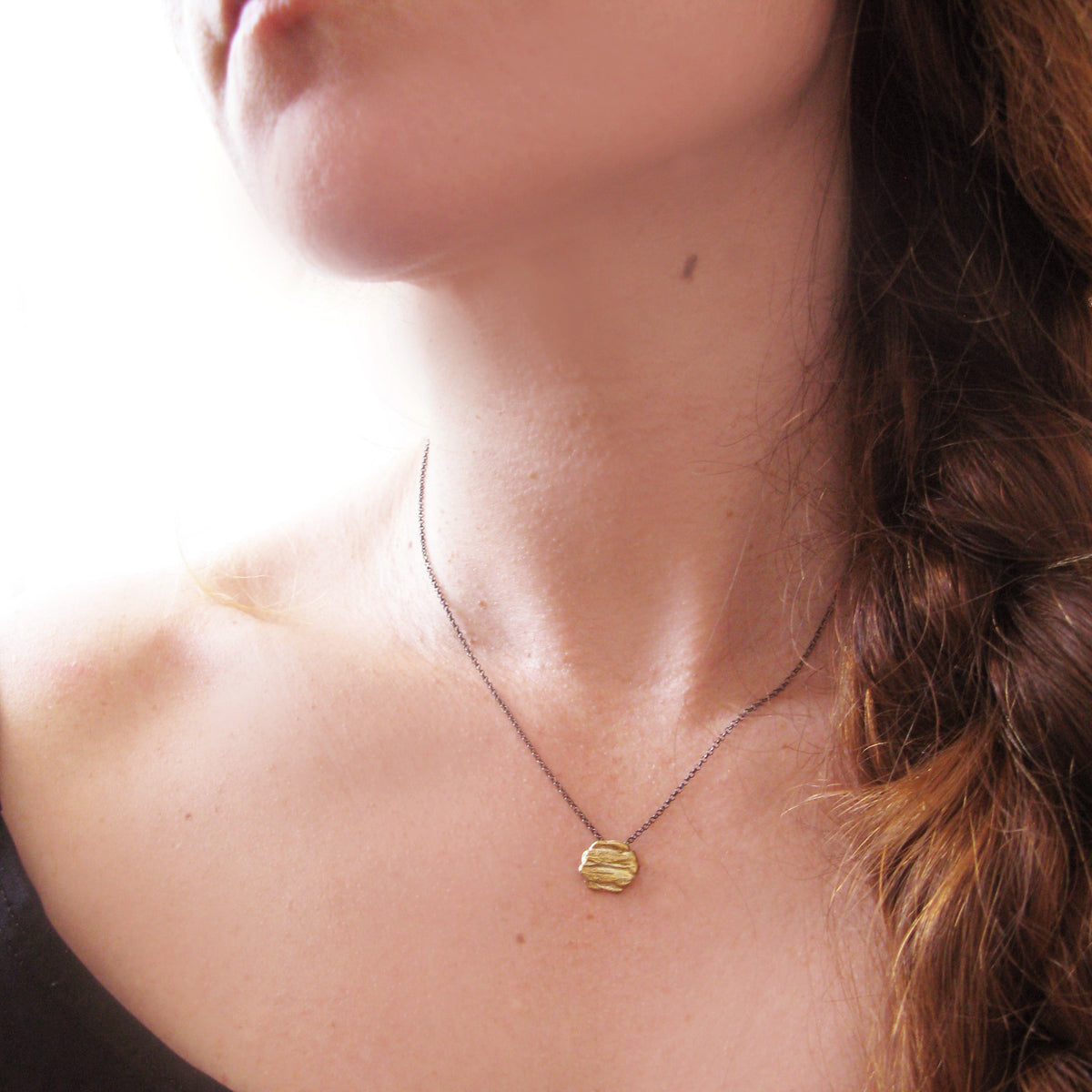 Nugget charm necklace worn on model handmade in Athens