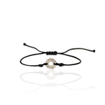 Black cord bracelet with a silver circular charm . A talisman, sun, helios by Athenart, Greek jewelry designers 