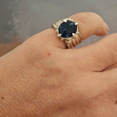 One-of-a-kind sodalite ring in sterling silver worn on hand, adjustable size 50–52