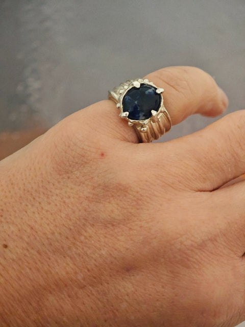 One-of-a-kind sodalite ring in sterling silver worn on hand, adjustable size 50–52