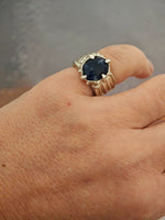 One-of-a-kind sodalite ring in sterling silver worn on hand, adjustable size 50–52