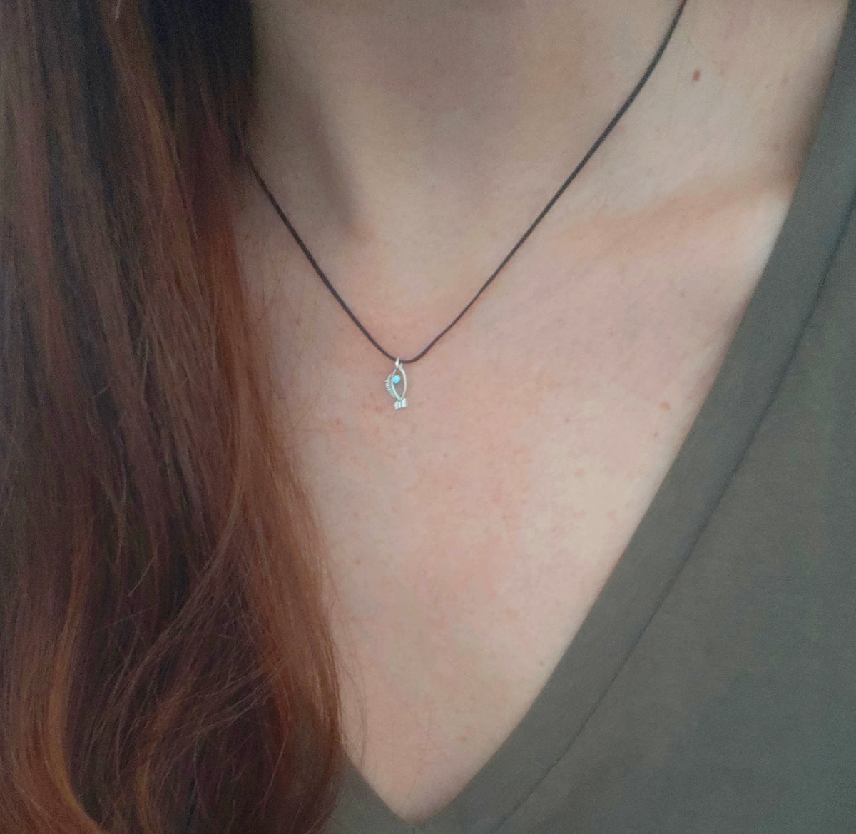 Silver tiny fish charm with blue zircon, an eye talisman for everyday by Athenart, handmade jewelry based in Athens, Wholesale greek jewelry avaialble