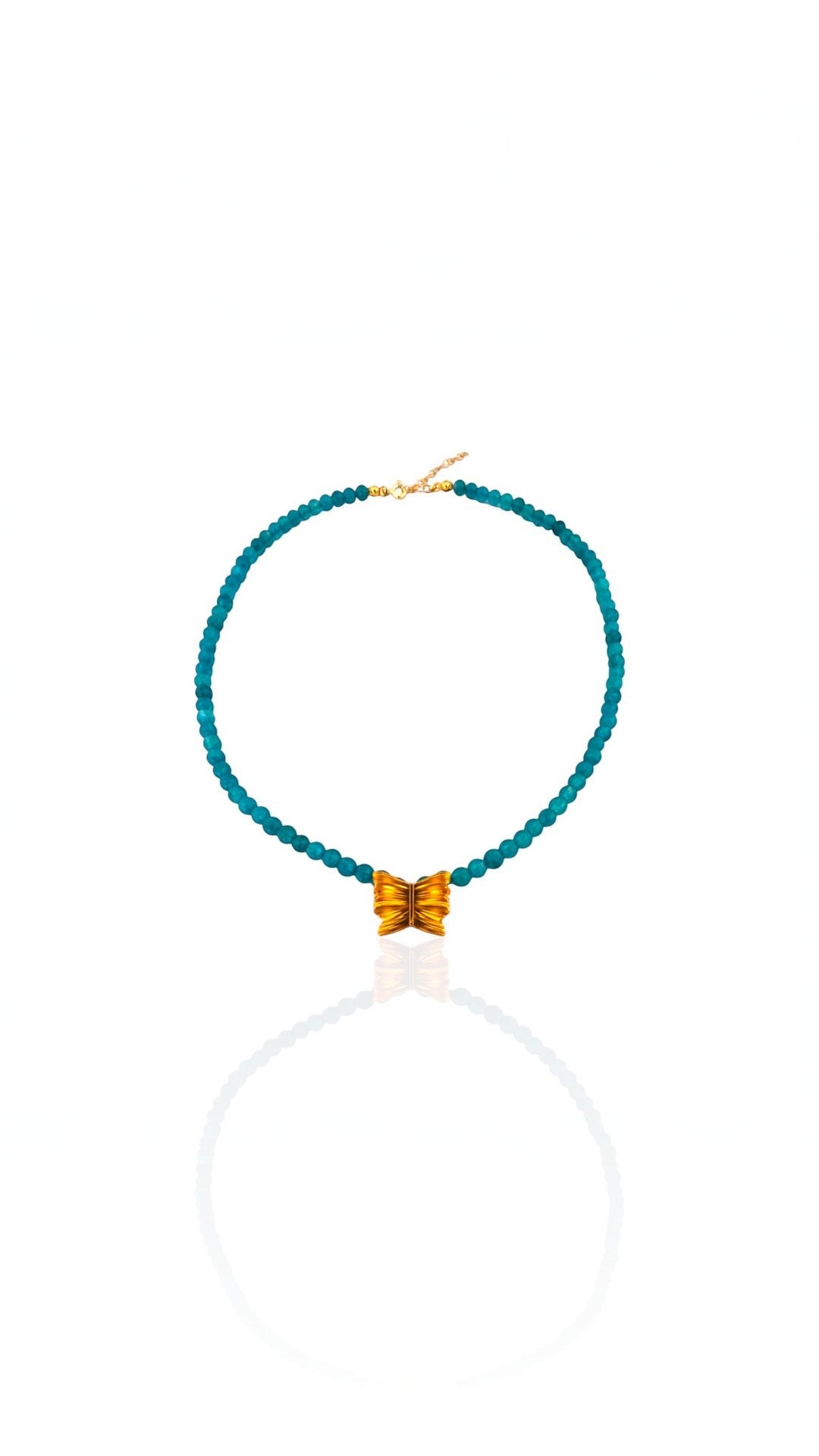 Turquoise beaded necklace with a gold clasp on a white background