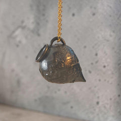 Sculptural oxidized silver Amphora pendant suspended from a gold-plated chain