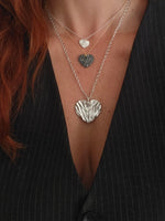 Silver Heart, kardia, necklaces with chains worn. Retails, wholesale jewelry by Athenart made in Greece.