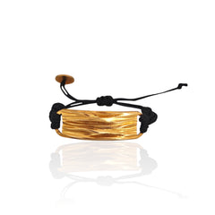 Peplos drapé bar cord bracelet in gold plated finish on white background