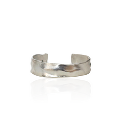Silver cuff bracelet on a white background