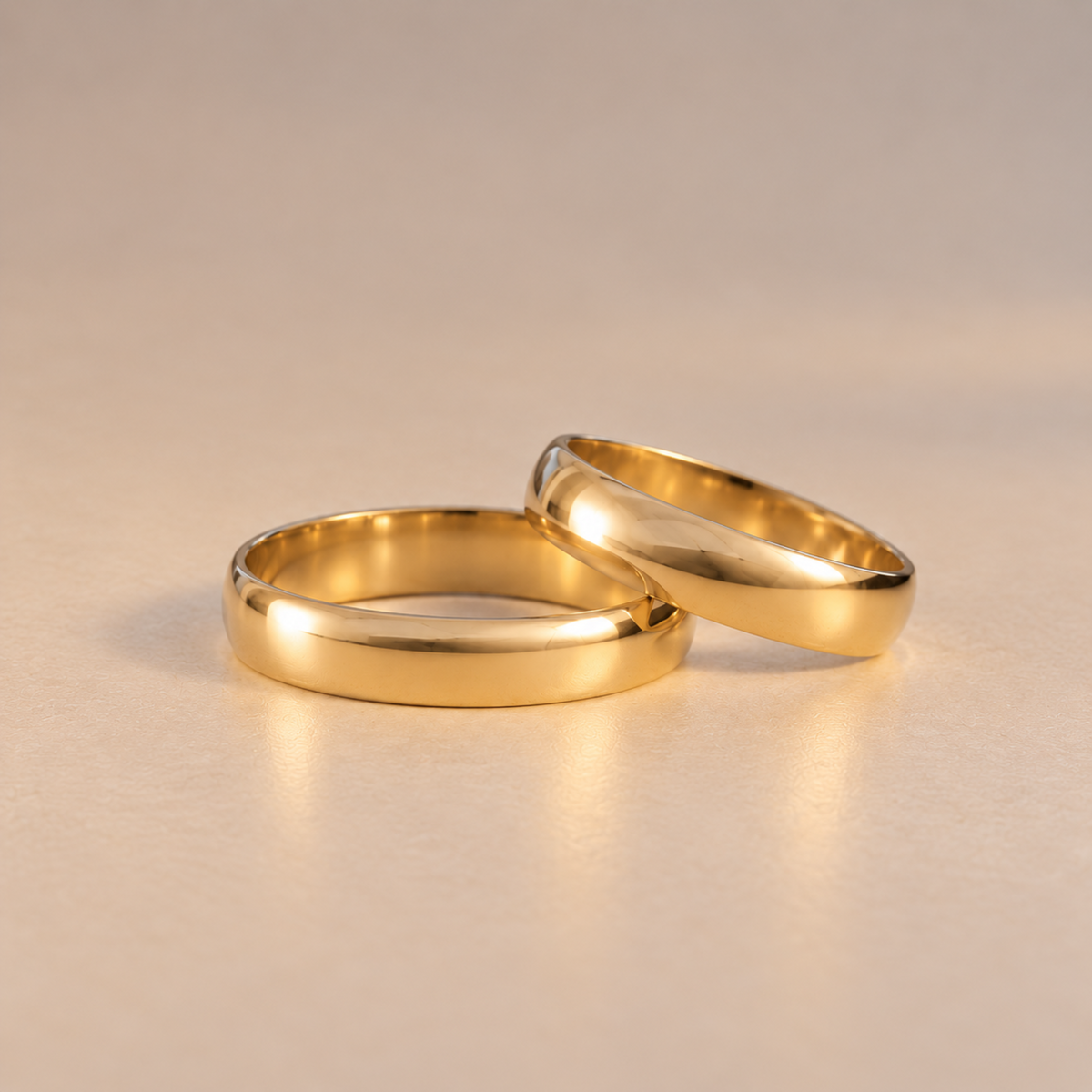 Matching 4mm solid yellow gold wedding bands with polished domed profiles
