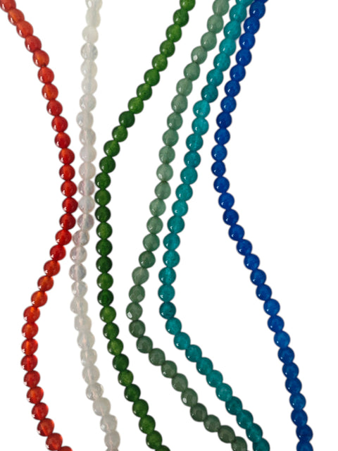 Set of colorful beaded necklaces on a white background