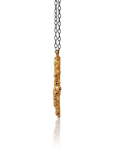 Organic stick pendant necklace in gold plated silver with zircons