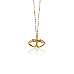 Gold necklace with an eye-shaped pendant on a white background