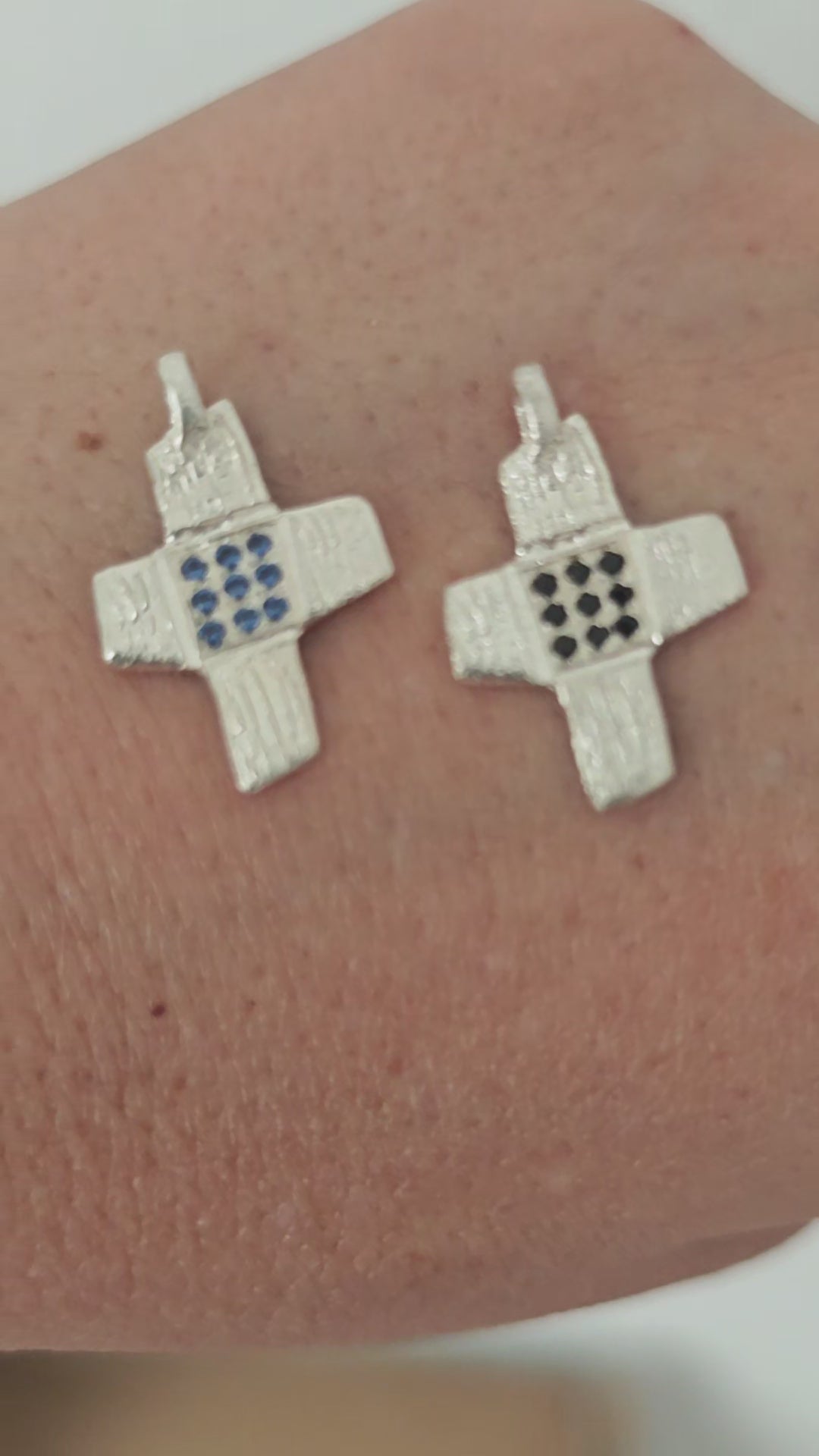 Unique sculpted crosses with zircons