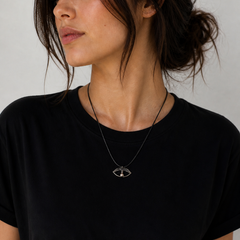 Minimal eye talisman necklace in oxidized silver finish on black cord by Athenart