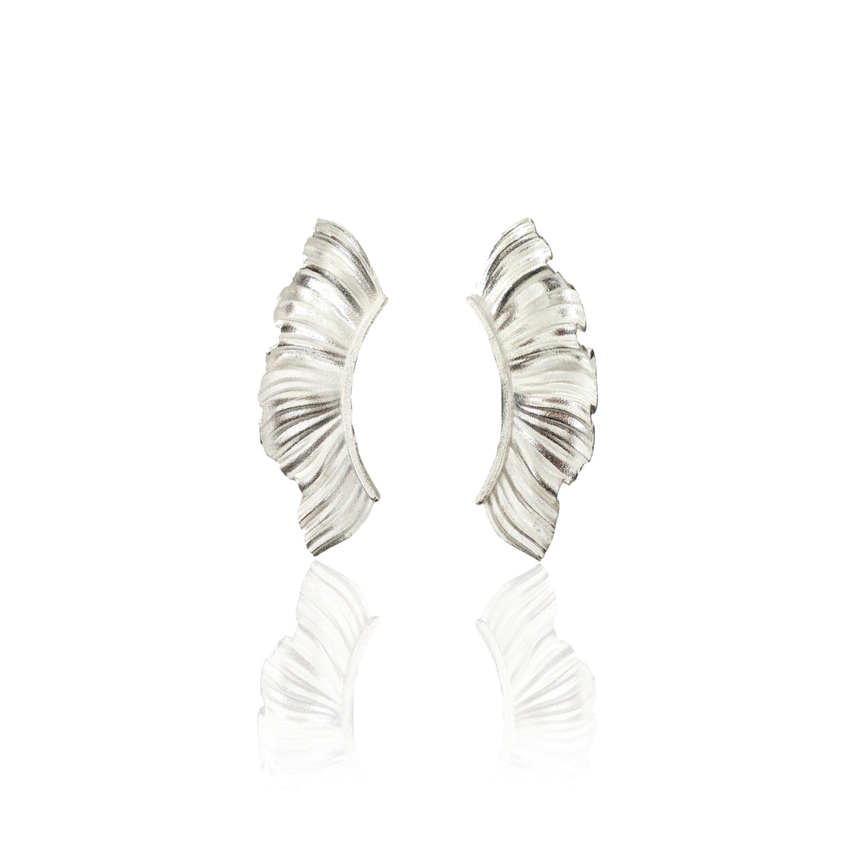 Aether wing ear climber earrings in sterling silver on white background
