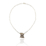 Necklace with a textured pendant on a white background